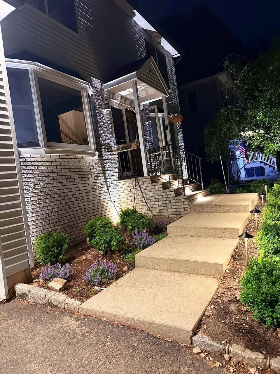 Front steps and entry lit with path lights