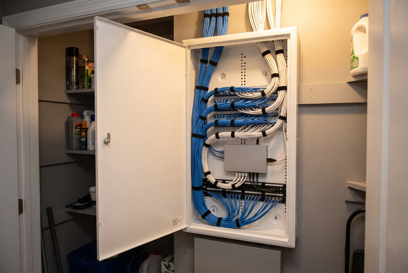 Tidy structured wiring panel with network cable and a switch